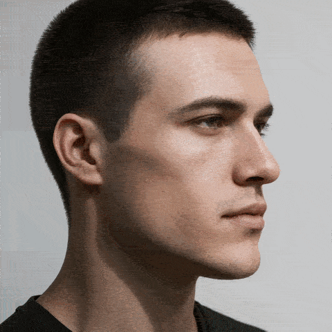 Side profile of a man chewing, masseter muscle flexing at the jaw angle